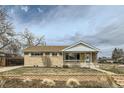 Charming single-story home with a brick facade, tidy landscaping, and a cozy front porch at 283 Garland Dr, Northglenn, CO 80233