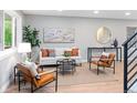Bright and airy living room with neutral tones and modern furniture at 1660 S Kingston Way, Aurora, CO 80012
