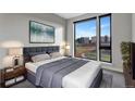 Spacious bedroom with large windows and a view at 6618 E Lowry Blvd # 210, Denver, CO 80230