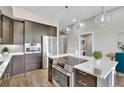 Modern kitchen featuring stainless steel appliances and an island at 6618 E Lowry Blvd # 210, Denver, CO 80230