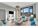 Bright living room with large windows offering scenic views at 6618 E Lowry Blvd # 210, Denver, CO 80230