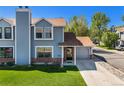 Attractive two-story home with a well-maintained lawn and an attached one car garage at 5250 Cody St, Arvada, CO 80002