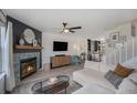 Inviting living room with stylish fireplace, comfortable seating, and modern decor at 5250 Cody St, Arvada, CO 80002