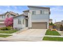 Charming two-story home with modern design, landscaped yard, and a two-car garage at 11048 Rifle Ct, Commerce City, CO 80022