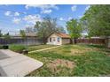 Spacious backyard with a storage shed and ample room for outdoor activities and gardening at 4591 S Pennsylvania St, Englewood, CO 80113