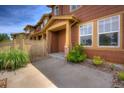 Attractive townhouse exterior with stone accents and a cozy entrance at 10451 Truckee St # 2D, Commerce City, CO 80022