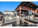 Rooftop patio with comfortable seating, outdoor kitchen, and views of the city at 1792 Wynkoop St # 505, Denver, CO 80202