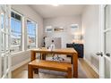 Bright home office featuring a large window, a wooden desk, and a comfortable seating area at 6334 N Dayton Way, Denver, CO 80238