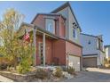 Charming two-story home with eye-catching architectural details, well-kept landscaping, and a brick driveway at 2514 Sweet Wind Ave, Castle Rock, CO 80109