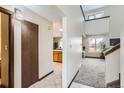 Inviting hallway with tiled floors and a glimpse into the adjacent living spaces at 206 S 22Nd Ave, Brighton, CO 80601