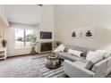 Comfortable living room with a fireplace and a view to the front yard at 206 S 22Nd Ave, Brighton, CO 80601