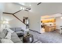 Bright living room with staircase and kitchen area at 206 S 22Nd Ave, Brighton, CO 80601