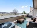 Relaxing outdoor balcony with comfortable seating and scenic views of the surrounding landscape at 4226 S Eldridge St # 207, Morrison, CO 80465
