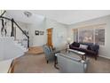 Comfortable living room featuring hardwood floors and ample natural light at 8430 S Oak St, Littleton, CO 80127