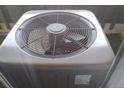 Close-up shot of an outdoor residential air conditioning unit with a circular fan guard at 10772 E Exposition Ave Ave # 342, Aurora, CO 80012