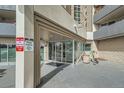 Entrance with glass doors and signage, along with parking restrictions posted at 601 W 11Th Ave # 815, Denver, CO 80204