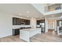 Modern kitchen with stainless steel appliances, an island, and stylish finishes at 98 Wooten Ave, Brighton, CO 80601