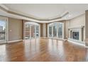 Spacious living room boasting hardwood floors, fireplace, and large windows with city views at 1827 N Grant St # 502, Denver, CO 80203