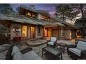 Charming outdoor patio with comfortable seating, perfect for enjoying the serene setting and unique architecture at 4406 Orofino Pl, Castle Rock, CO 80108
