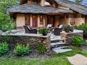 Charming patio area with stone accents, comfortable seating, and beautiful landscaping, perfect for outdoor relaxation at 4406 Orofino Pl, Castle Rock, CO 80108