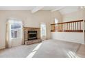 Living room with brick fireplace and vaulted ceiling at 19366 E Greenwood Pl, Aurora, CO 80013