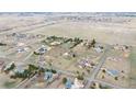 Expansive aerial view showcasing homes, streets, and open grassy areas in a community at 12337 2Nd St, Parker, CO 80134