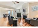 Cozy living room features a fireplace, vaulted ceilings, wood floors and an open layout at 2838 Cascade Creek Dr, Lafayette, CO 80026