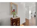 Elegant entryway with ornate mirror and stylish wood cabinet at 5455 Landmark Pl # 604, Greenwood Village, CO 80111