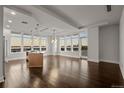 Open concept kitchen with island and hardwood floors at 5455 Landmark Pl # 604, Greenwood Village, CO 80111
