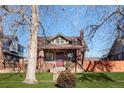 Attractive brick home with a well-maintained lawn at 3311 W Clyde Pl, Denver, CO 80211
