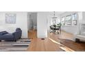 Bright living room with hardwood floors and stylish furniture at 3311 W Clyde Pl, Denver, CO 80211