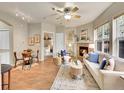 Open-concept living space featuring fireplace and hardwood flooring at 16366 E Fremont Ave # 3, Aurora, CO 80016