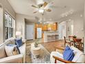 Inviting open-concept living area with a breakfast bar and hardwood flooring at 16366 E Fremont Ave # 3, Aurora, CO 80016
