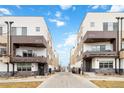 View of modern townhomes with private balconies creating an attractive, contemporary streetscape at 2622 W 24Th Ave # 4, Denver, CO 80211