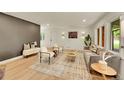 Inviting living room featuring modern decor, stylish furniture, and ample natural light for a cozy atmosphere at 3736 S Hibiscus Way, Denver, CO 80237
