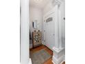 Bright entryway featuring a decorative accent table, white door with glass, and classic white columns at 613 S Logan St, Denver, CO 80209