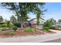 Beautiful exterior of home with lush lawn, showcasing attractive landscaping at 3458 S Norfolk Way, Aurora, CO 80013