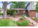 Close up of front yard featuring landscaped walkway to the home at 3458 S Norfolk Way, Aurora, CO 80013