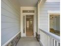 A well lit, open entryway showing wood floors and easy access to the garage at 625 Kendall Way, Lakewood, CO 80214