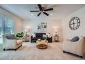 Bright living room boasts stylish furnishings, large windows, and a cozy atmosphere at 907 Stein St, Lafayette, CO 80026