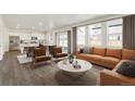 Open concept living room and kitchen with modern furniture at 2262 Base St, Fort Lupton, CO 80621