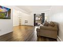 Spacious living area with hardwood floors and a view to the kitchen at 4653 S Lowell Blvd # B, Denver, CO 80236