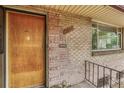 Close-up of the front door showcasing brick detail, house number, and a welcoming entrance at 3854 Perry St, Denver, CO 80212