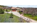 Well-maintained home with a long driveway and two car garage at 440 Scrub Oak Cir, Monument, CO 80132