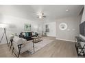 Comfortable living room boasts lots of natural light and an open layout at 7833 S Kittredge Cir, Englewood, CO 80112