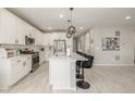 Stylish kitchen with modern appliances, a large island, and pendant lighting at 4925 Coltin Trl, Castle Rock, CO 80104