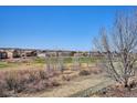 Scenic backyard view overlooking the golf course and neighborhood, offering serene outdoor living at 6971 S Netherland Way, Aurora, CO 80016