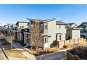 Exterior angle of a modern house with a well-maintained yard and modern architectural style at 10610 E 26Th Ave, Aurora, CO 80010