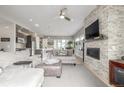 Spacious living area with fireplace, open to kitchen, with ample natural light at 3142 W 20Th Ave, Denver, CO 80211