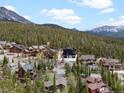 A view of an upscale mountain community with beautiful homes surrounded by evergreen trees and mountain views at 436 N Fuller Placer Rd, Breckenridge, CO 80424